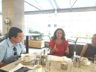 Ekaterina Mouratova, Esq., is counseling the artists at the Art Terrace panel discussion hosted by RE:ARTISTE